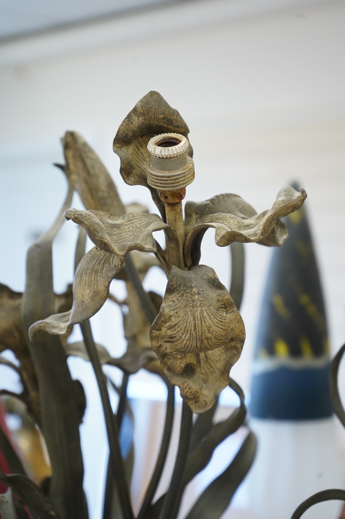 A pair of cold painted bronze floral lamps with painted cast iron campagna urns, 76cm high